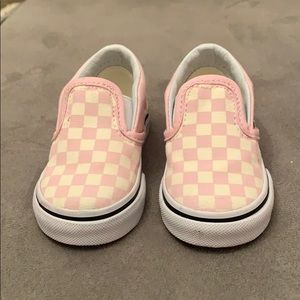 Pink and white slip on vans